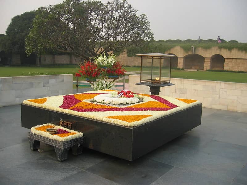 Raj Ghat, Black stone platform of Mahatma Gandhi cremation with flower decoration. 