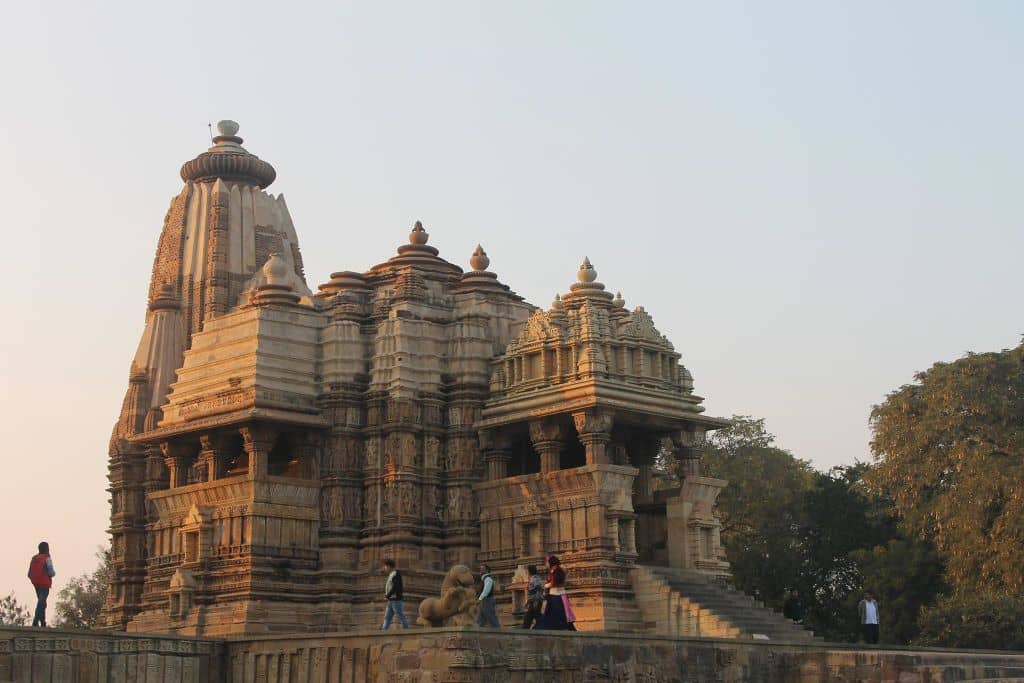 People walking at the platform of Devi Jagadambi Temple. 