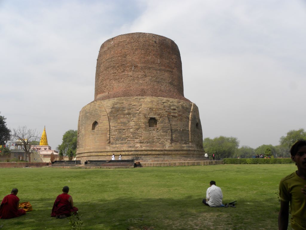 People are doing meditation front of Budha stupa in Sarnath