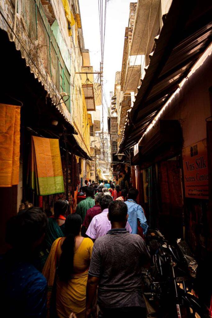 Narrow street in Varanasi with full of people. Varanasi Itinerary