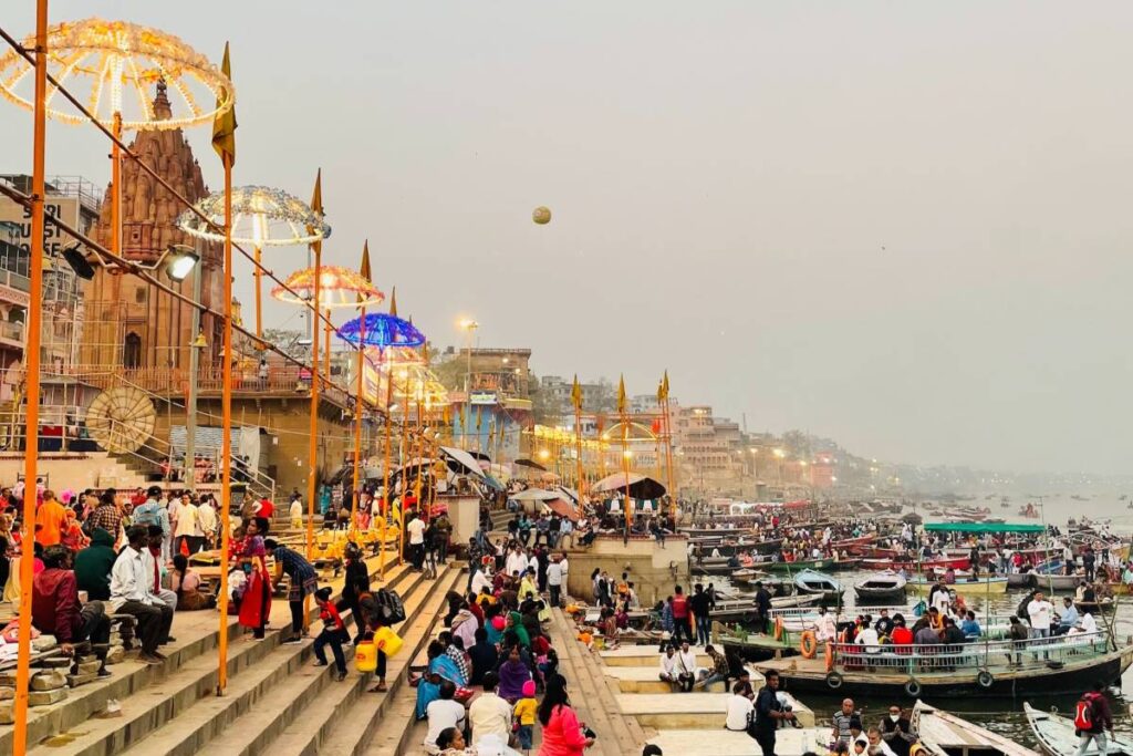 People are gathering on the Dashashwmedh ghat for evening Aarti
